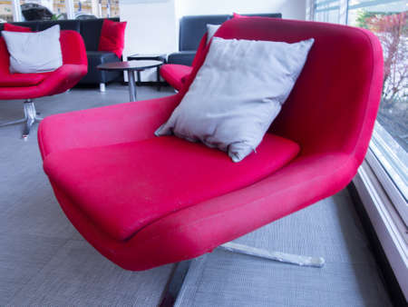 Modern interior with red armchairの写真素材