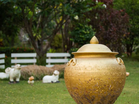 White Sheep Statue in Green Grass.の写真素材