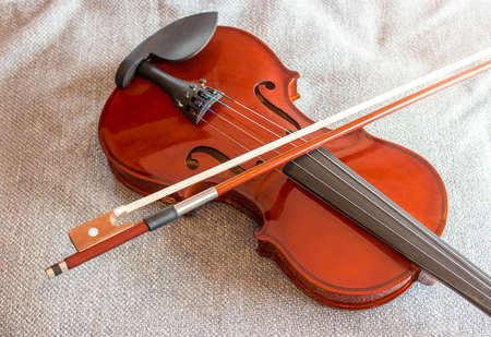 Violin on the bed with fabric backgroundの写真素材