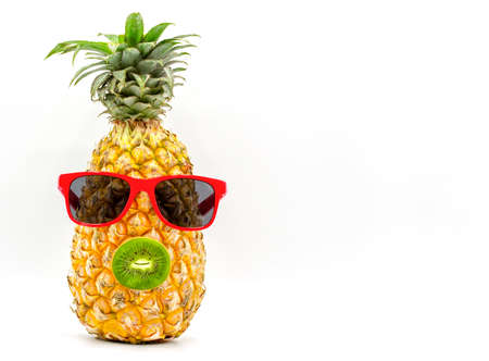 Pineapple isolated on white background with the concept of summer, wearing glasses and having kiwi...