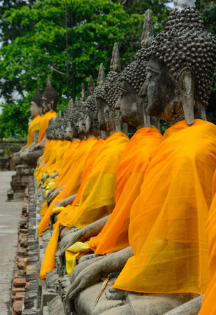Row of Buddha Status at Wat Yai Chaimongkol, Ayutthaya, Thailand の写真素材