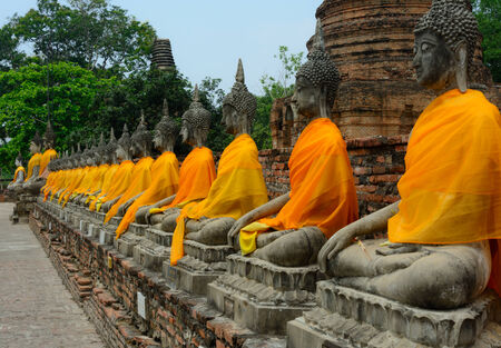 Row of Buddha Status at Wat Yai Chaimongkol, Ayutthaya, Thailand の写真素材