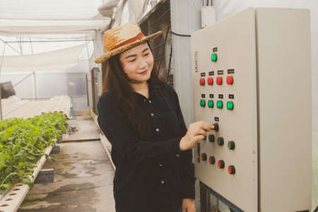 Beautiful Asian farmer in charge of organic vegetable gardens is launching a state-of-the-art...