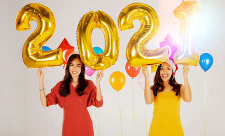 Concept happy new year and christmas : Beautiful Thai women count down to the New Year 2021 festival, giving everyone a smile.の写真素材