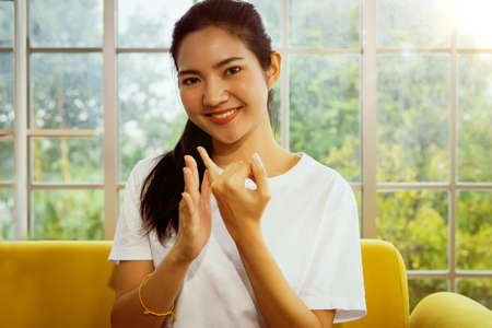 Video call online Asian women teach sign language for education and communication to people with hearing impairment to know and understand.の写真素材