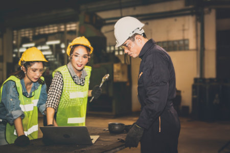 Blur image Meetings between engineering teams, Male engineer looks at the plans on the computer with the female technician to assign the duties : blurred  backgroundの写真素材