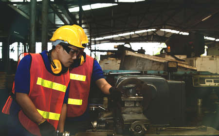 Work safety concept : Collective teamwork of professional metal turning technicians works efficiently to keep employees safe, healthy and the quality of workの写真素材