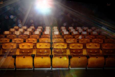 Projector flare and empty seats inside the cinema, beautiful in classic vintage style : Cinema without audiences during the Covid-19 epidemic : Selective Focusの写真素材