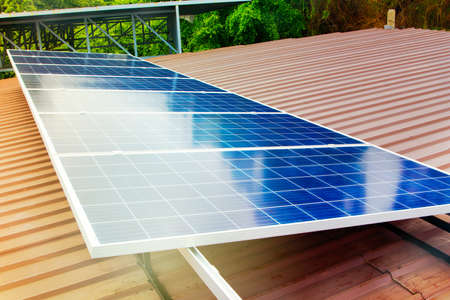 Solar cell containing solar energy is installed on the roof of the factory for industrial use : Installation of solar panels, use the space on the roof at medium sizeの写真素材