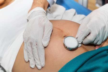 Doctors use medical headsets to listen to the fetus and develop infant movements in the mother's prenatal tummy, taking care during antenatal care.の写真素材