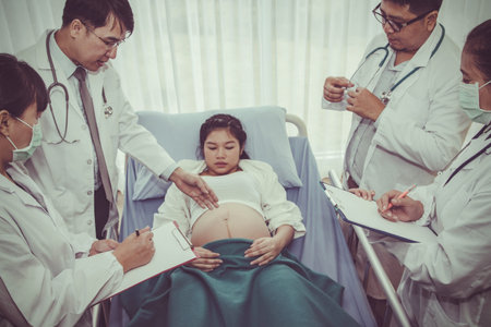 The team of doctors came to take care of pregnant women preparing for childbirth with healthy health.の写真素材
