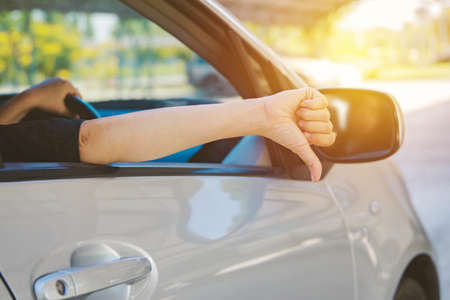 Concept of daily traffic problems : 
Ladies traveling thumbs up. Boring and feeling bad while...