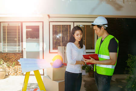 Female homeowner was pleased with the planning, modification, renovation of the floor plan, having the male architect in charge of the project and correcting it to make it a beautiful new house.の写真素材