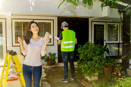 Renovation house concept : Positive financial readiness of beautiful Asian woman are happy to...