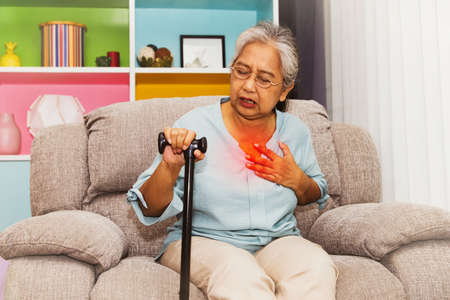 Elderly women have respiratory problems : Elderly women had symptoms of a cold, exhaustion. Cough and chest pain in elderly people with impaired immune system : Elderly health insurance conceptの写真素材
