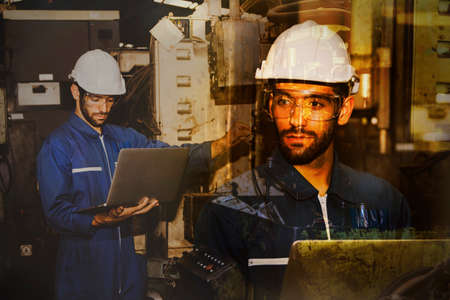 Double exposure effects portrait hipster handsome engineer In the helmet set, check the process of maintenance and maintenance of industrial machinery.の写真素材
