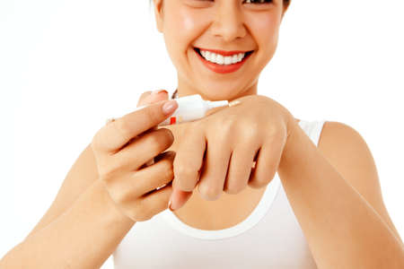 Hand closeup Asian women with beautiful skin use lotion, soft cream, UV protection to protect the skin and the danger from sunlight and tropical regions.の写真素材