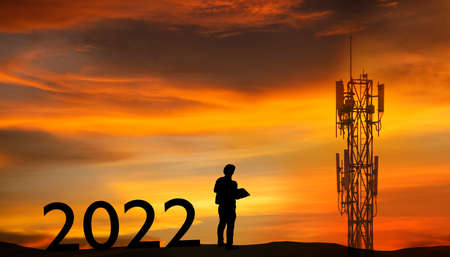 Silhouette Architect,Engineer,man standing plans 2022 preparatory Project on paper blueprints...