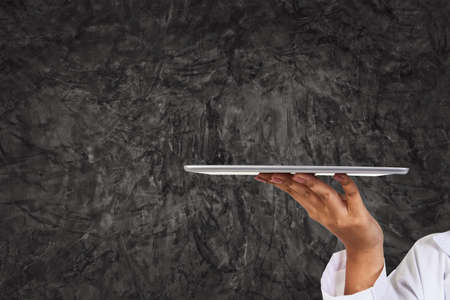 Hand of female doctor, psychiatrist, obstetrician,surgeon, ophthalmologist, pediatrician, veterinarian in white uniform holding tablets for make up spacesの写真素材