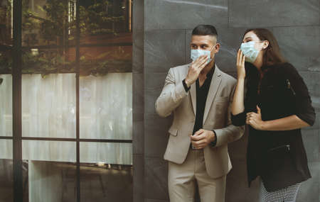Health care of business men and women wearing medical masks to prevent flu when going out of the...