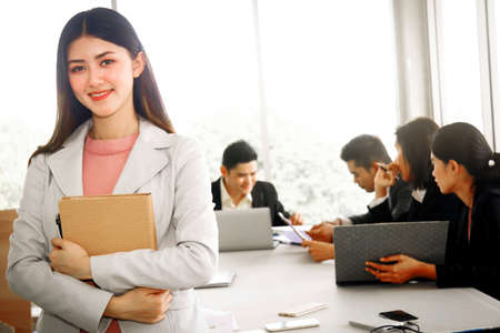 The start of a new generation of business women happy in the beginning standing in front of the conference tableの写真素材