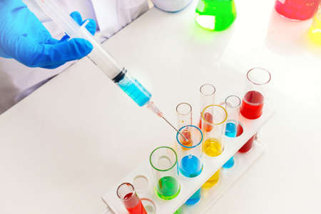 Science concept : Experimental liquid chemicals in laboratory test tubes closeup.の写真素材