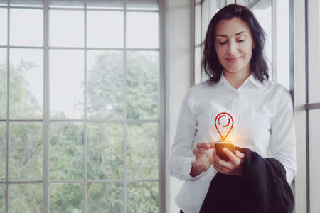 Senior  businesswoman inspect the place and check-in the place she is at this time with happy online phone : Copy spaceの写真素材