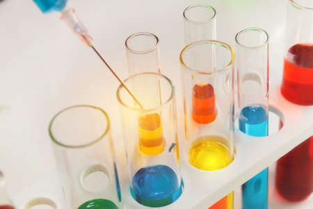 Scientist or researcher conducts experiments and researches scientific liquids in vitro within a research laboratory.の写真素材