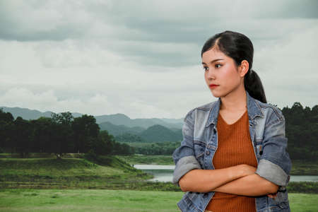 Asian woman traveling with tropical mountain nature in Southeast Asia : Beautiful women in nature green background.の写真素材