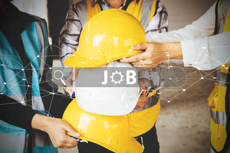 Team of engineers working together on construction site. Engineering and architecture concept.の写真素材