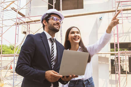 Beautiful woman owner new house housing estate seeks advice from male architect to carry out...