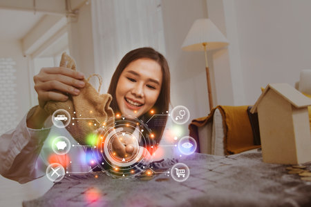 Asian women enjoy saving money that can be spent on make insurance travelling holiday shopping, buying car, checking their health and doing beauty cosmetic surgery of their choiceの写真素材