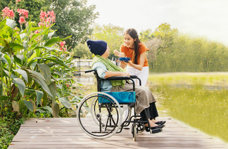 Asian family, grateful daughter takes care of mother who is sick and  feeds her food to restore her body and keep her healthy : Elderly insurance health care conceptの写真素材