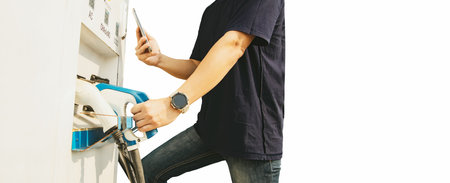 Man using smartphone scanning application bar code connected DC power supply terminal for use with electric vehicle battery EV battery socket on white background.の写真素材