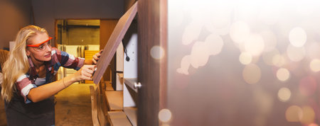 Female carpenter worker woodworking designer furniture small home and office cabinets made of plywood and inspect open and close view beautiful and safe designs prepare to be shippの写真素材