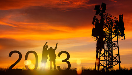 Silhouette architect electrician team at sunset two engineers pointing telecom tower planning 2023 working towering outdoor telecommunication antenna that will improve the efficienの写真素材