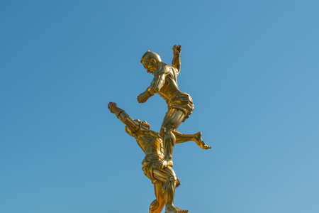 Muay Thai bronze statue on blue skyの写真素材