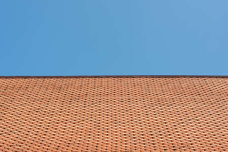 Clay tile roof and blue skyの写真素材