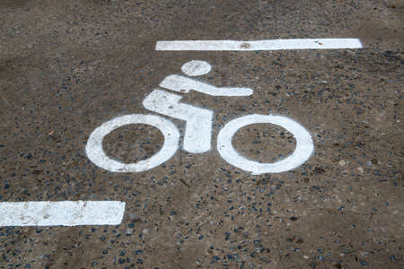 Bike lane sign on roadの写真素材
