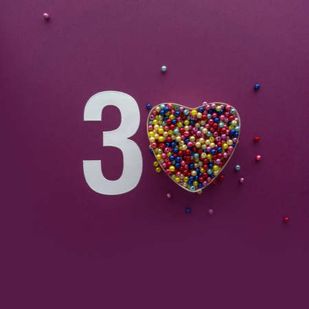 30 number thirty, creative typography with colourful balls on violet background, happy birthday,...