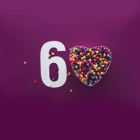 60 number sixty, creative typography with colourful balls on violet background, happy birthday, anniversary, happy Valentines day, walentynki, chapter presentationの写真素材