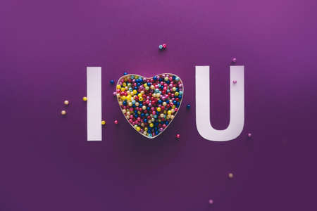 Heart with colourful balls on violet background, happy birthday, gift and love, creative typography, happy Valentines day, walentynkiの写真素材