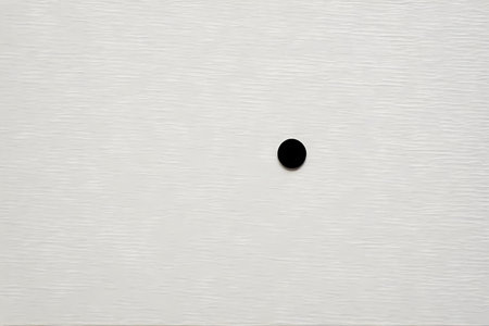 Black hole in the white wall. Background and texture for design.