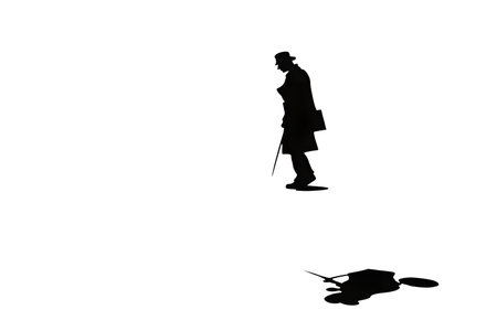 Silhouette of a man walking on a white background.の写真素材