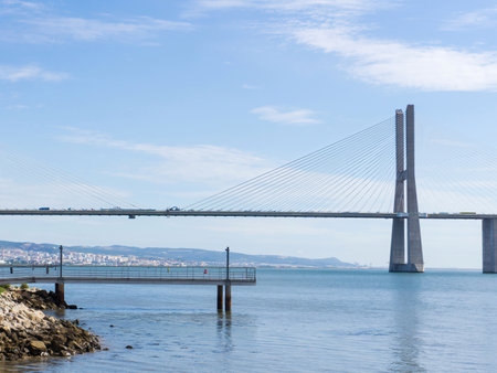 View from the embankment to the Vasco da Gama bridge in Lisbon, Portugalの写真素材