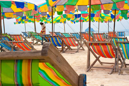 A sandy sea beach with bright multi-coloured umbrellas ,Phuket Thailandの写真素材