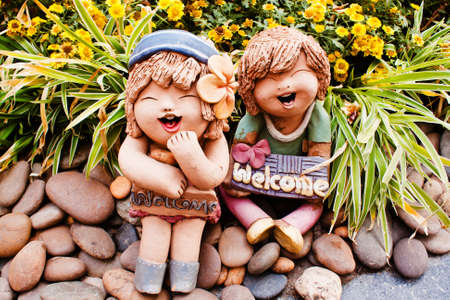 Welcome sign and clay boy   girl dollの写真素材