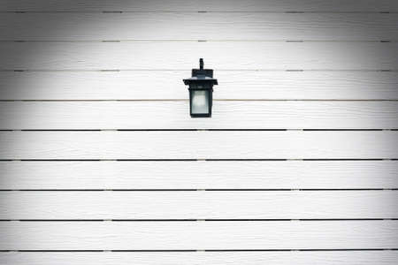  Lamp on white empty  wood backgroundの写真素材