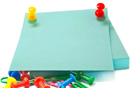 note papers with push pins on white backgroundの写真素材