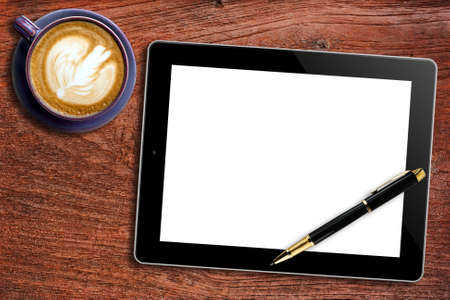 Blank Tablet,pen and cup of coffee on wooden backgroundの写真素材